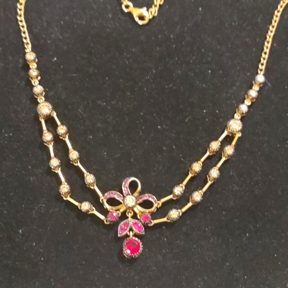VINTAGE NECKLACE WITH FLORAL AND. STONE CENTER
